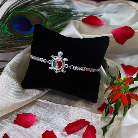 Silver Finish  Rakhi With Red-green Enamel